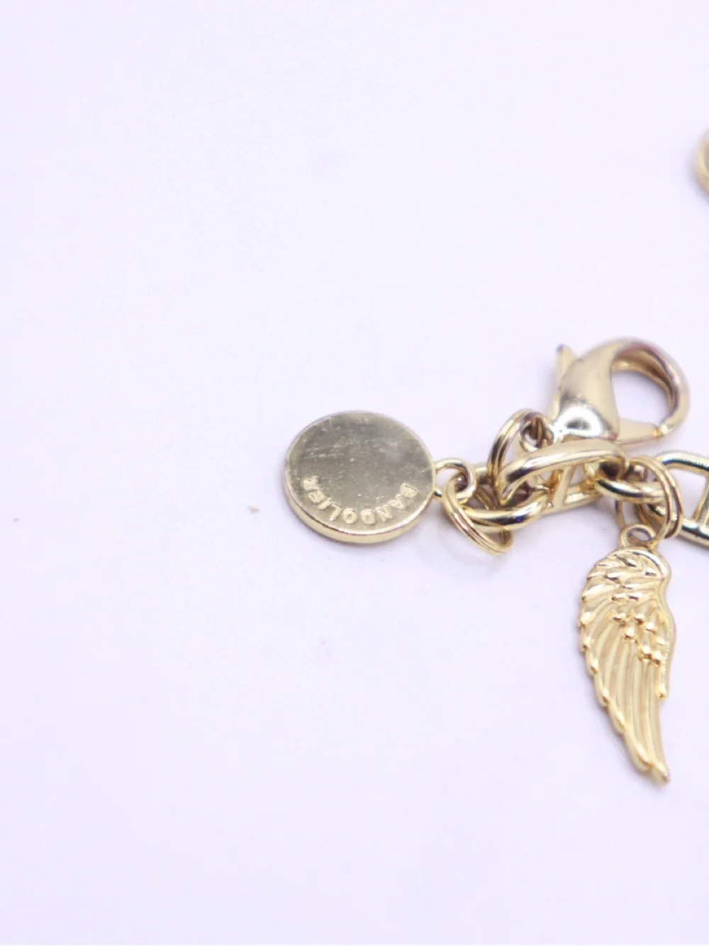 Bandolier Gold-Tone Charm Wristlet Bracelet with Star, Wing & Disc Charms - Picture 2 of 5